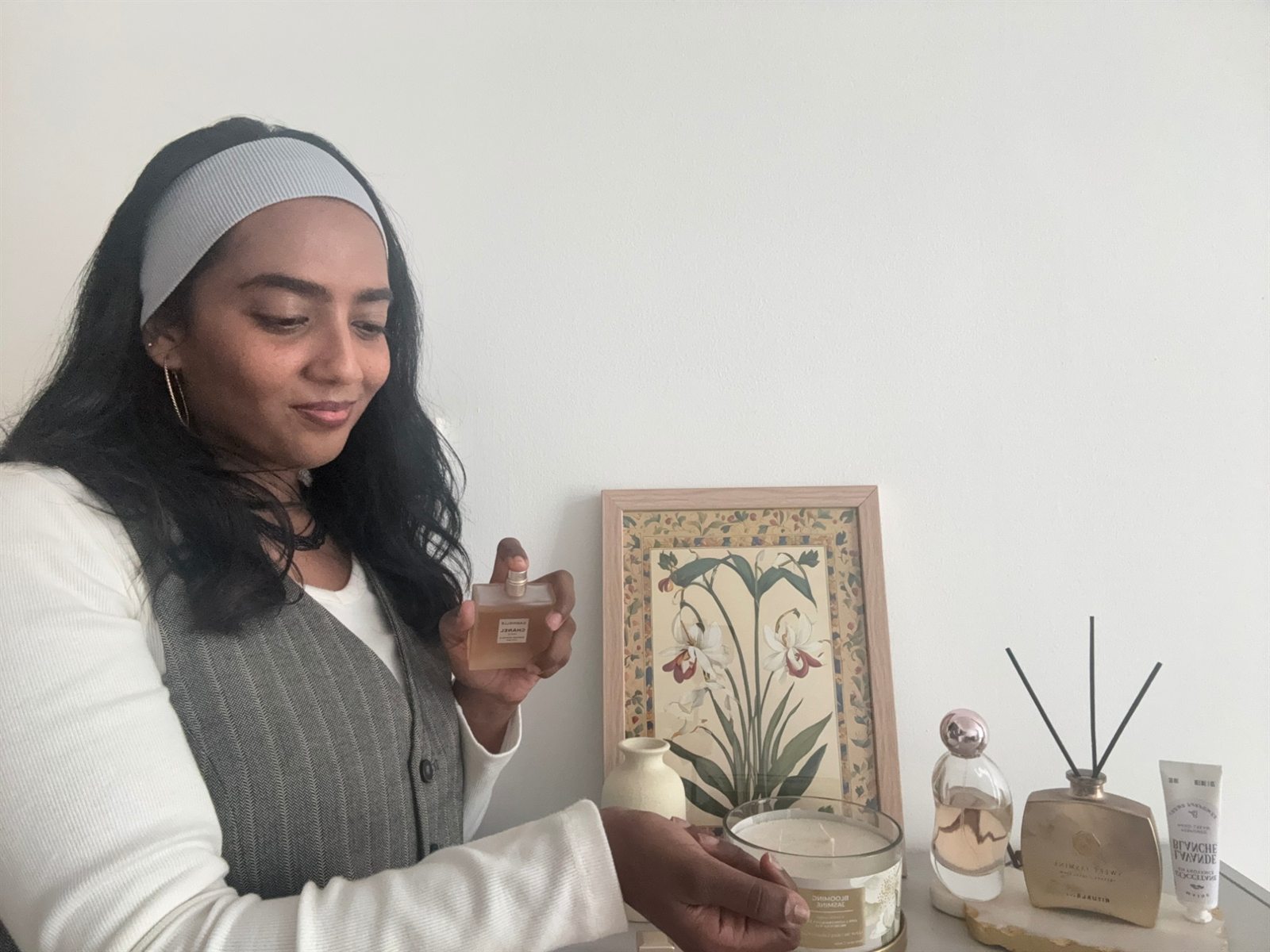 Abigail holding a bottle of Chanel Gabrielle hair mist